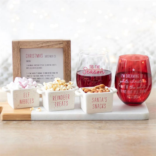 christmas stemless wine glass displayed in festive home setting with seasonal decor