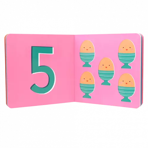 babys first numbers book opened to an inside page showing simple number illustrations for early counting practice