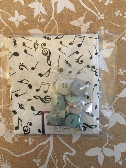 musical notes and dark blue with white flowers fat quarter with coordinating buttons
