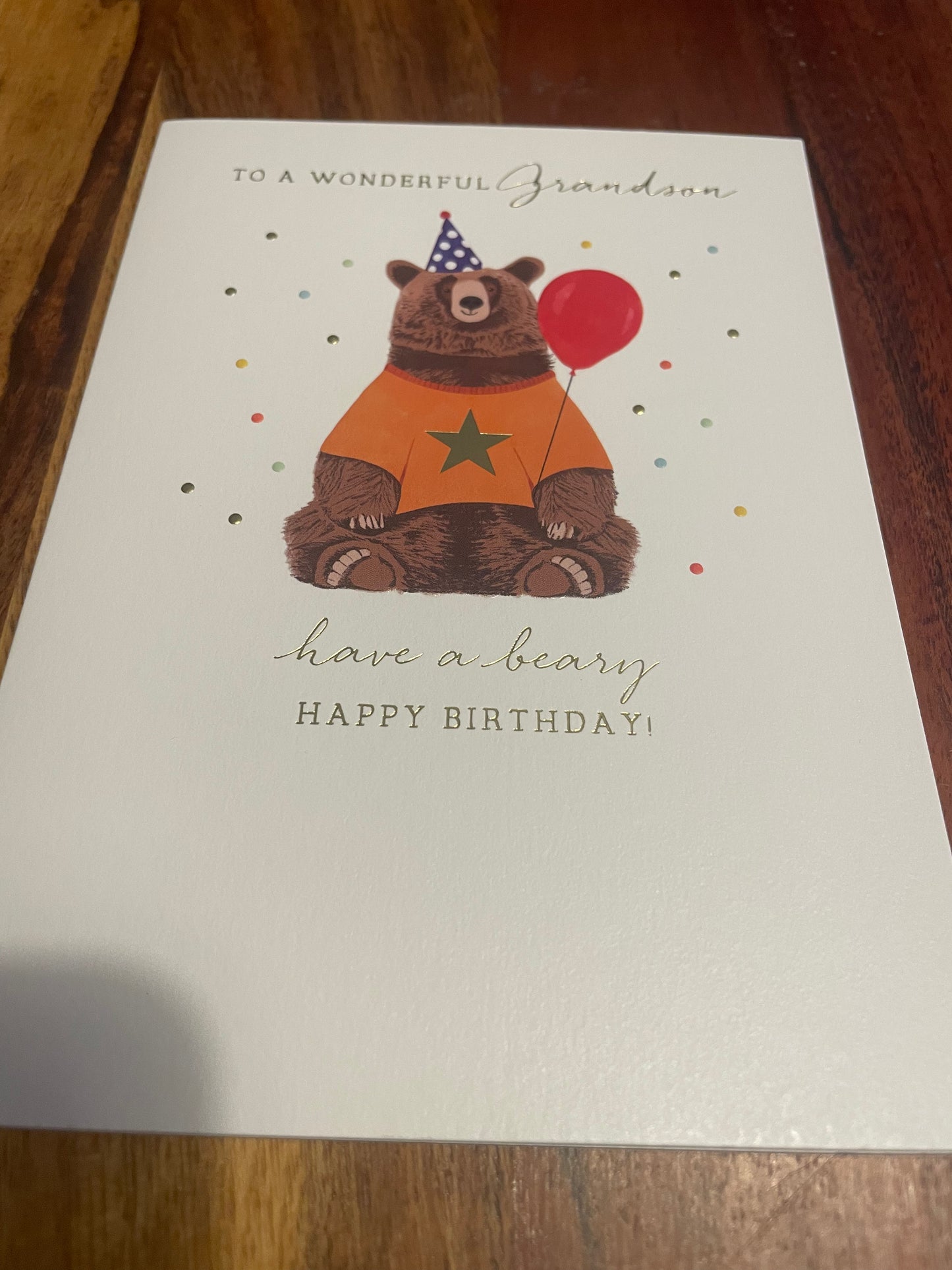 grandson bear birthday card with illustrated bear holding balloon for children