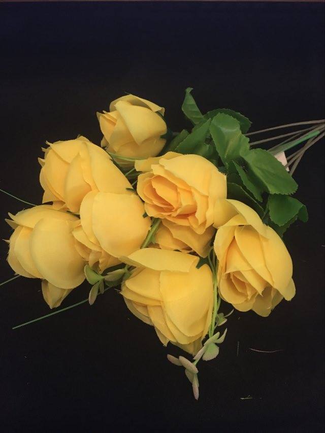artificial silk rose flower bunch photographed individually to show stem length and shape