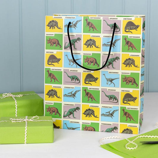 dinosaur themed gift bag showing size and depth, prehistoric land children’s gift bag suitable for birthday presents