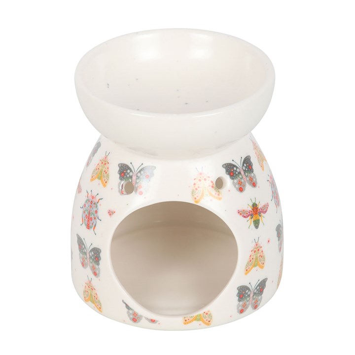 back view of floral bug ceramic oil burner showing decorative pattern