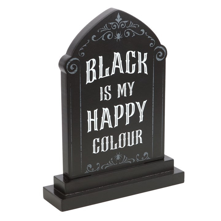 angled view of gothic tombstone sign highlighting carved alternative design