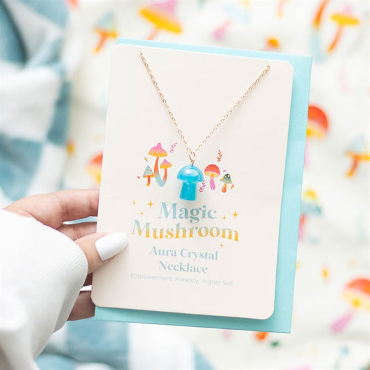 blue mushroom aura necklace greeting card styled in home setting with colourful charm