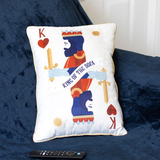 king of the sofa playing card cushion styled on chair in living space