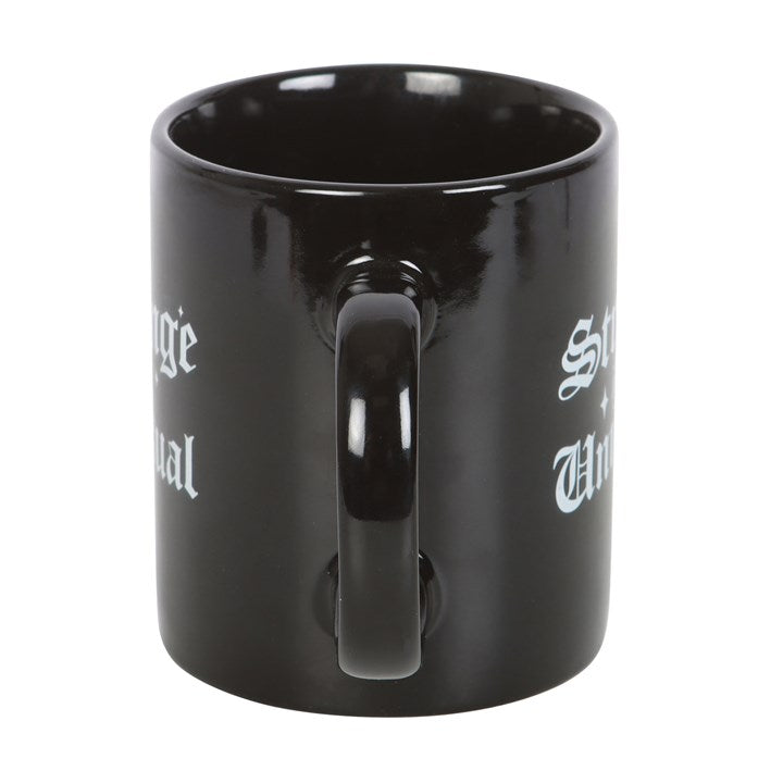 strange and unusual gothic mug handle view highlighting comfortable grip
