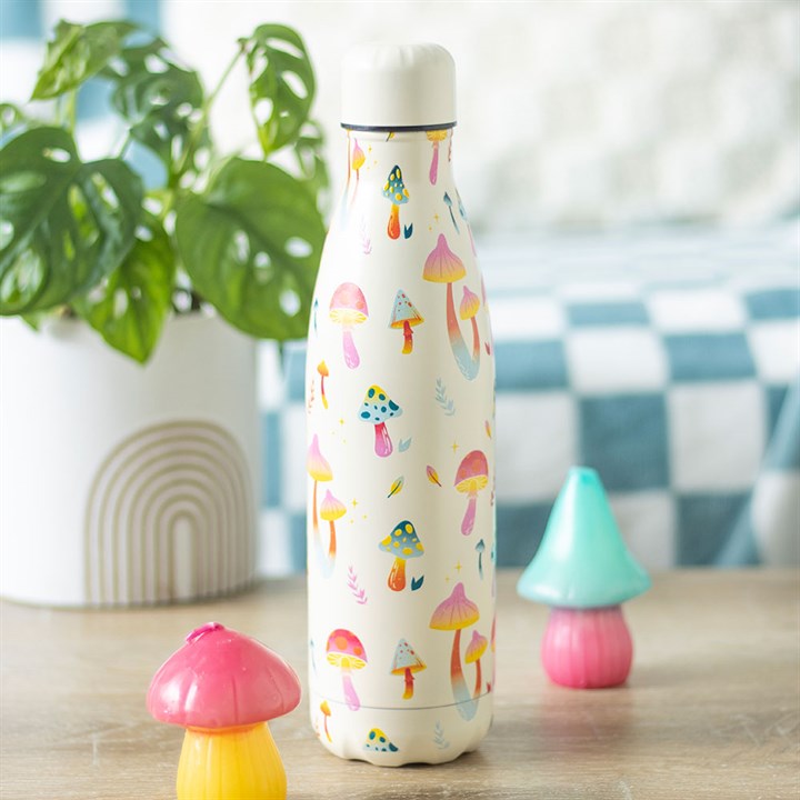 stay groovy mushroom water bottle styled in home setting with colourful woodland design