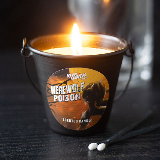 werewolf poison vanilla scented candle in metal bucket styled in dark home setting