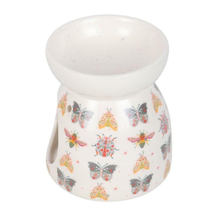 side view of floral bug ceramic wax burner highlighting sculpted shape