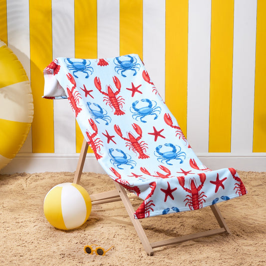 Red lobster microfibre beach towel displayed on deckchair outdoors