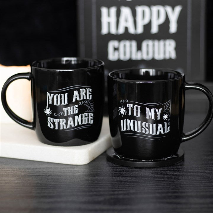 you are the strange to my unusual gothic mug set styled together in home setting