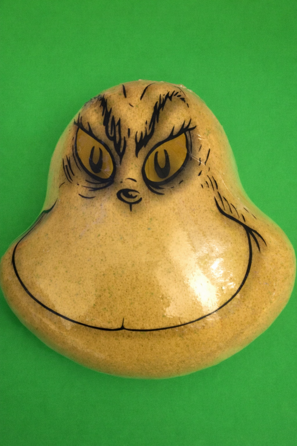 the grinch bath fizzer weighing 200g, creating a fizzy, colourful bath experience with the grinch’s signature scent for festive relaxation