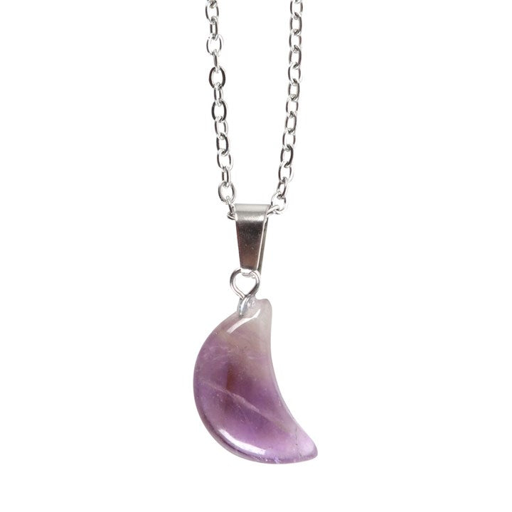 close up of amethyst crystal moon pendant showing delicate celestial detailing