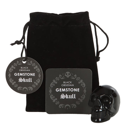 black obsidian crystal skull shown unbagged beside protective drawstring pouch