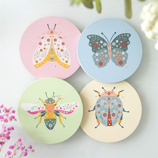 floral bug coaster set displayed in home setting featuring nature inspired insect designs