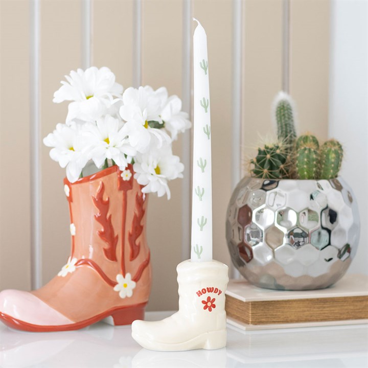 cowboy boot candle holder with cactus taper styled in western inspired home setting