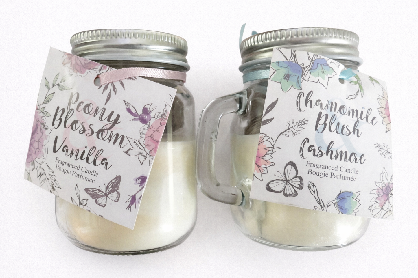glass jar scented candle with handle displaying peony blossom and chamomile blush options
