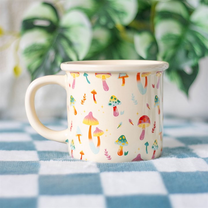 stay groovy mushroom ceramic mug styled in home setting with colourful woodland design