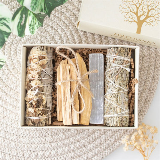 palo santo and sage energy cleansing kit contents displayed inside gift box