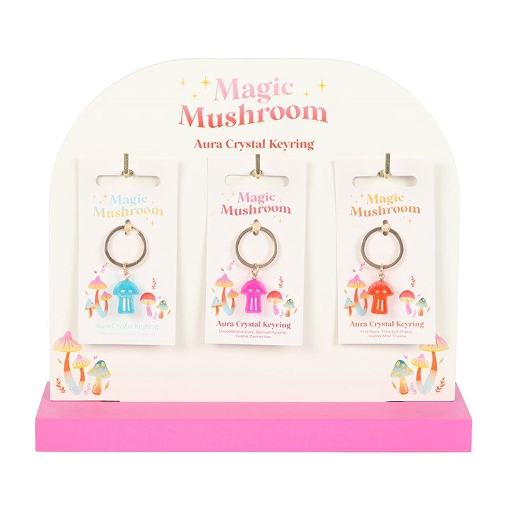 aura mushroom keyring collection displayed on stand showing different designs