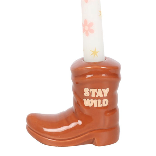 rear view of cowboy boot candle holder showing sculpted ceramic form and candle placement
