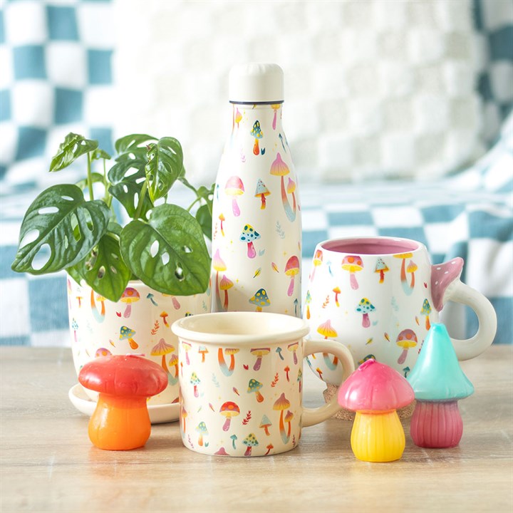 stay groovy mushroom reusable water bottle displayed in relaxed home environment