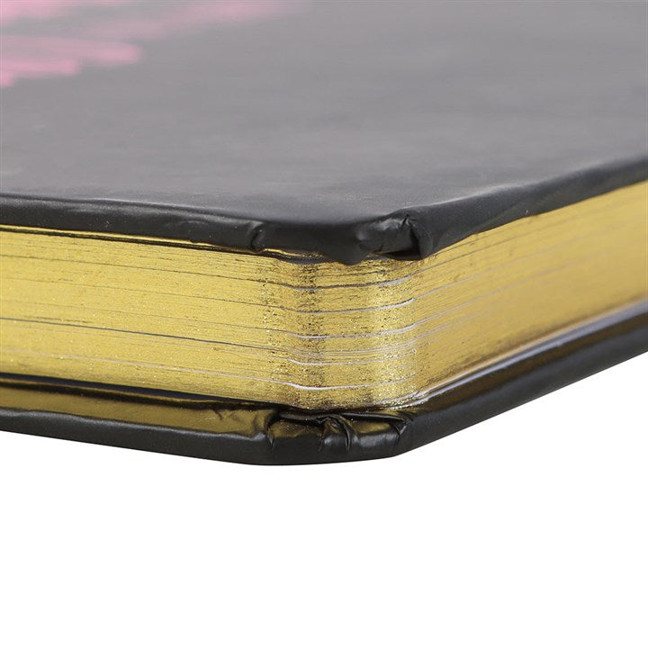 edge view of notebook showing decorative metallic page edging
