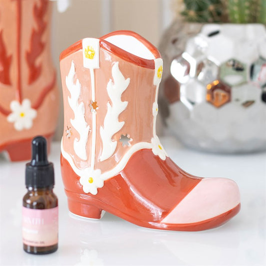 cowboy boot shaped wax burner displayed in home interior with bold western charm