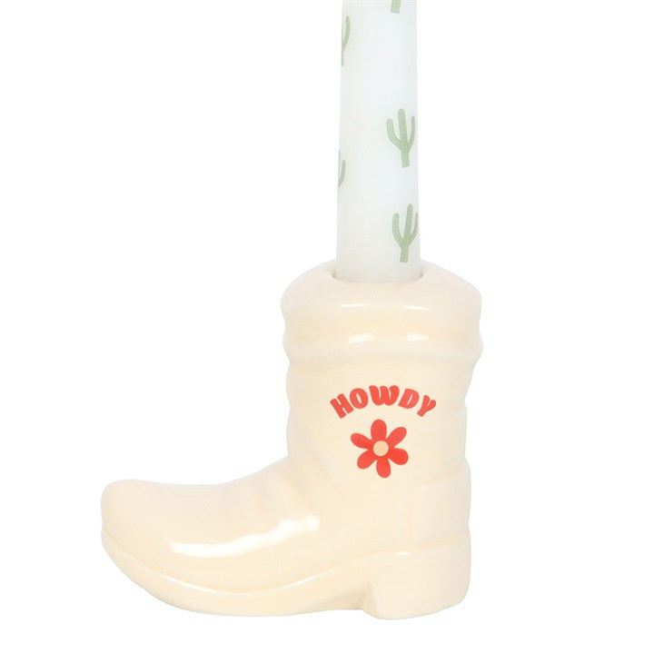 back view of boot shaped candle holder with taper candle displayed for decorative styling