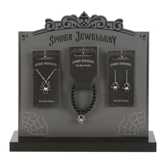 obsidian spider jewellery collection displayed on stand featuring necklace earrings and bracelet