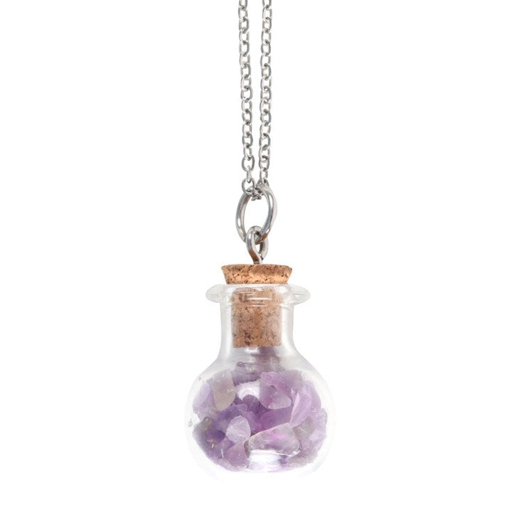 close up of amethyst crystal chips inside miniature potion bottle necklace