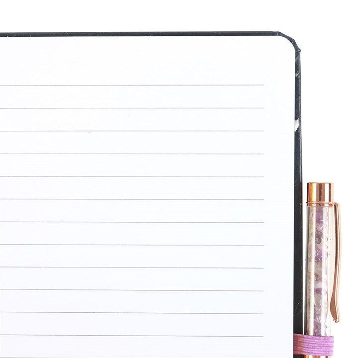 lined pages inside midnight moth journal shown open for writing and reflection