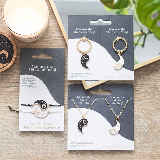yin and yang friendship jewellery set displayed in home setting showing bracelet necklace and keyring