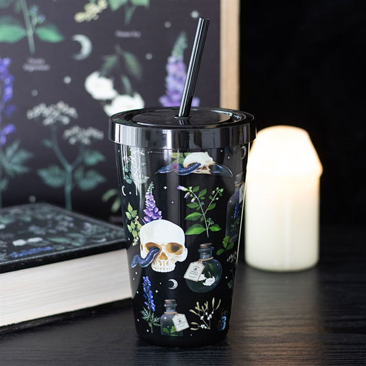 skull and venomous plants reusable tumbler displayed on window sill
