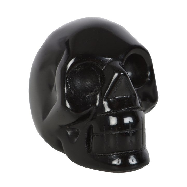 front view of black obsidian crystal skull showing polished gothic detailing