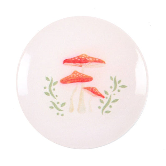 decorative mushroom trinket dish shown from above highlighting detailed illustrated design