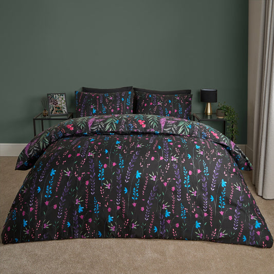 Super king black floral duvet cover set styled on bed with matching pillowcases