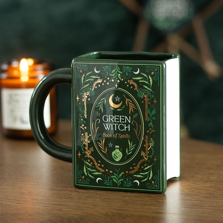 green witch spellbook ceramic mug styled in home setting with botanical aesthetic