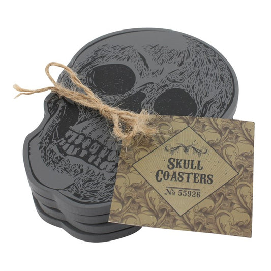 set of four skull coasters arranged together on neutral background