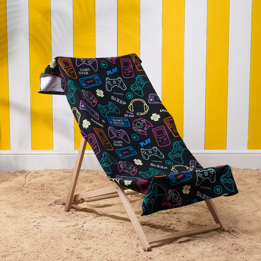 Black console gamer microfibre beach towel on deckchair, lightweight kids gaming beach towel