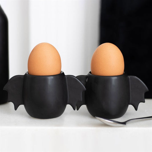 bat wing egg cup set shown holding eggs with playful gothic kitchen styling