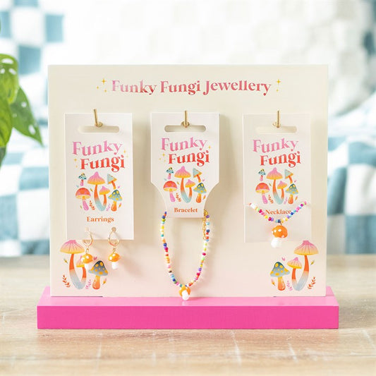 toadstool mushroom jewellery set displayed on stand featuring earrings necklace and bracelet