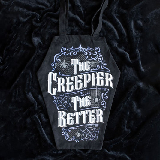 coffin shaped bag with the creepier the better text laid on black fabric
