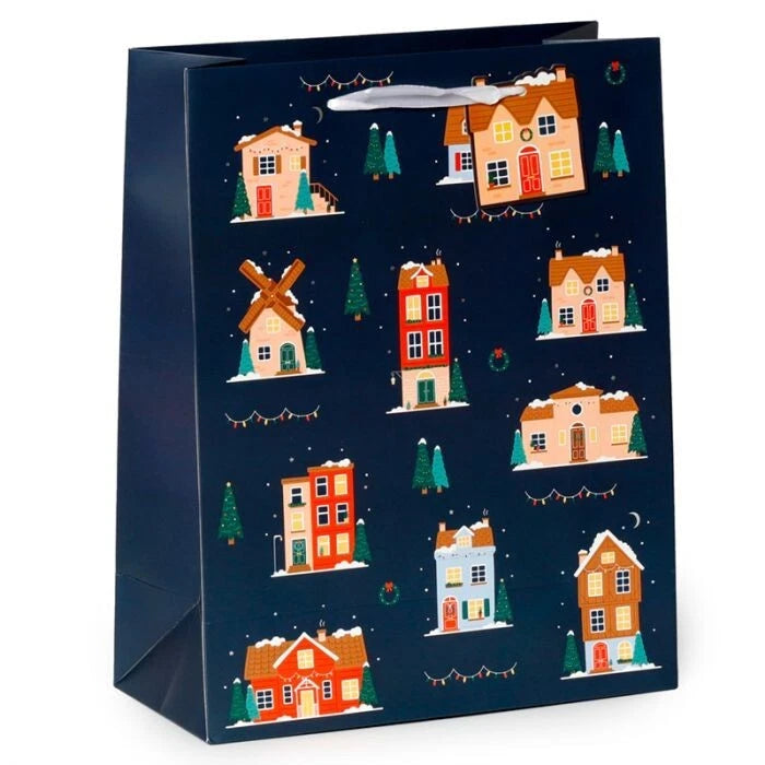 christmas village medium gift bag with illustrated festive scene and attached gift tag